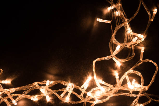 istock Christmas lights border. Christmas background with lights and free text space. Christmas lights on black background. New Year 1288040573