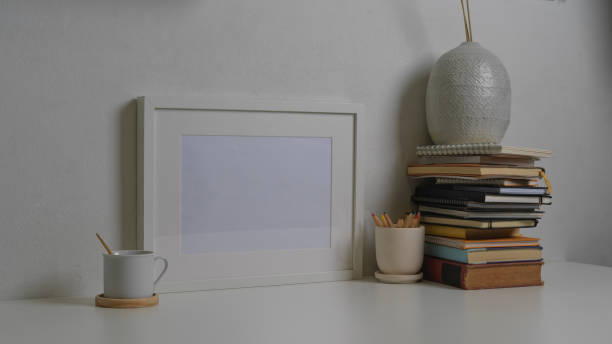 istock Workspace with tablet, laptop, books and decorations in home office room 1288041366