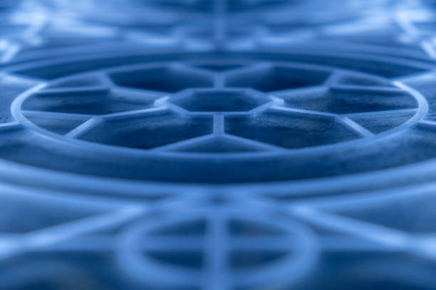 Abstract glass with geometric pattern in form of snowflake in perspective, selective focus.