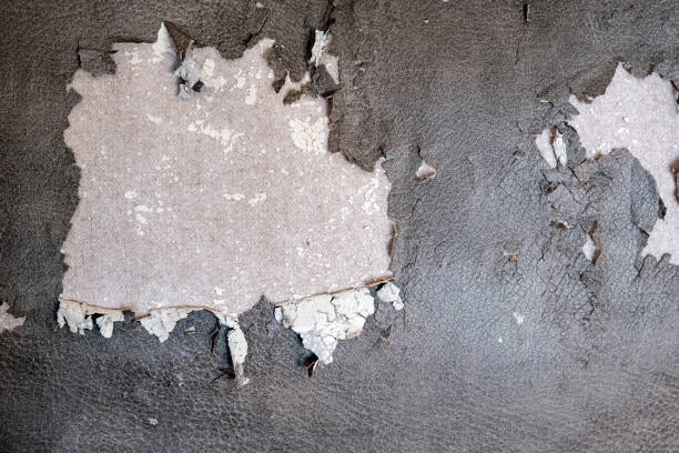 istock Brown damaged artificial leather texture background. Bad quality artificial leather, weathered leather. 1288044356