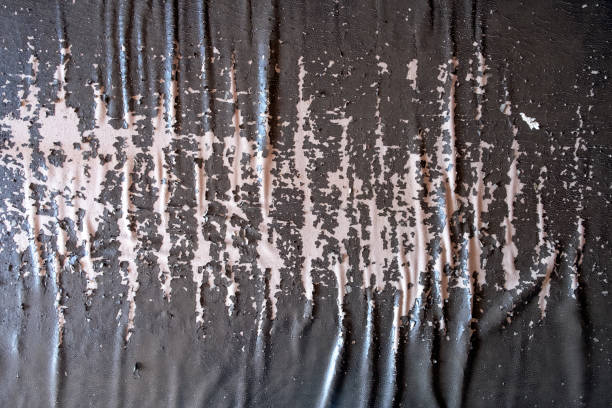 istock Brown damaged artificial leather texture background. Bad quality artificial leather, weathered leather. 1288044413