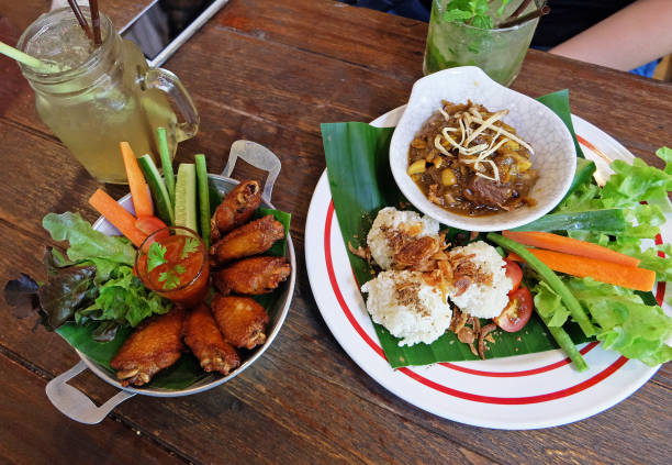 istock Fried sticky rice served with northern Thai curry and chicken wings 1288044811
