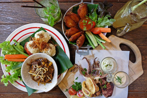 istock Fried sticky rice served with northern Thai curry, chicken wings and Battered deep fried calamari 1288044836