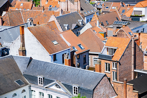 The roof of a modern new house. Tiled covering of building. Modern European house.