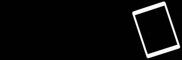 istock white tablet turned off on a black background. minimal black white concept. space for text. banner 1288048075