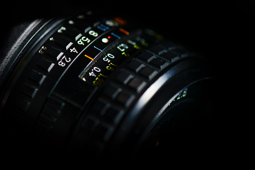Detail of lens for vintage SLR with mechanical diaphragm aperture