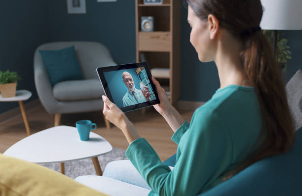 istock Woman having a video call with her doctor 1288054022
