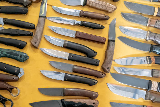istock Handmade hunting knives, different models and shapes. Hunting exhibition. 1288054184