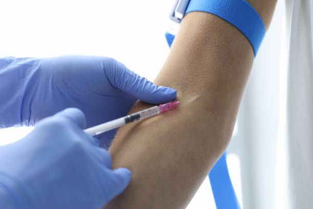 istock Nurse in rubber gloves makes intravenous injection closeup 1288055541