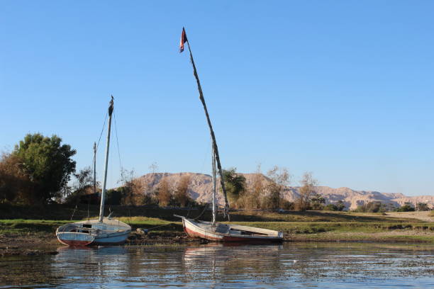 istock Two sail  boats lying on the river shore in Luxor in Egypt 1288056686