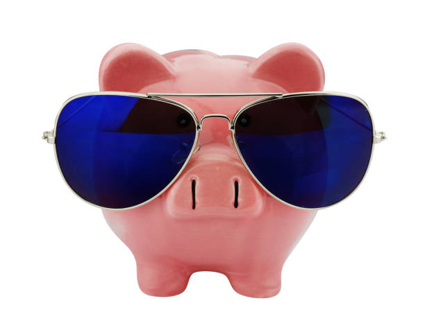 istock piggybank with sunglasses isolated on white 1288057918