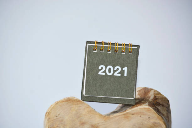 istock New Year 2021 calendar with wooden chopping board 1288059525
