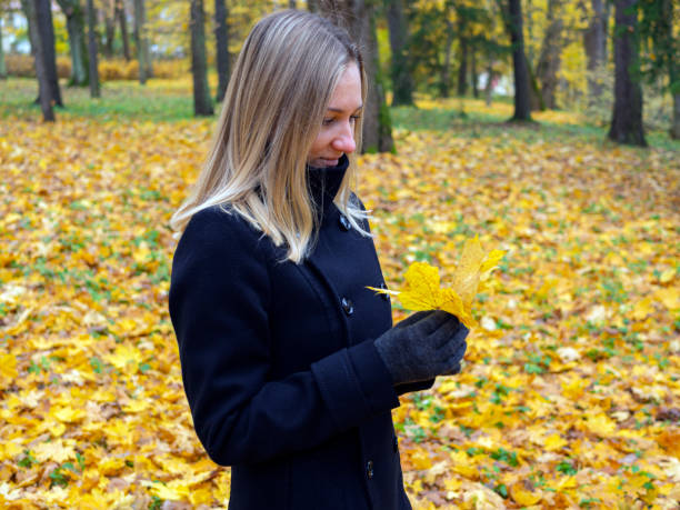 istock Girl in autumn park 1288062233