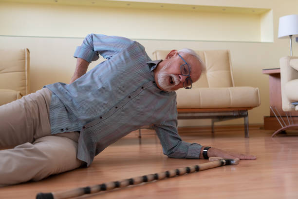 istock An Older Man with Walking Cane is Lying on the Floor After an Accident he had. 1288062387