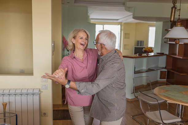 istock Happy Older Man and his Wife are Spending a Nice Time While Dancing at the Home. 1288062411