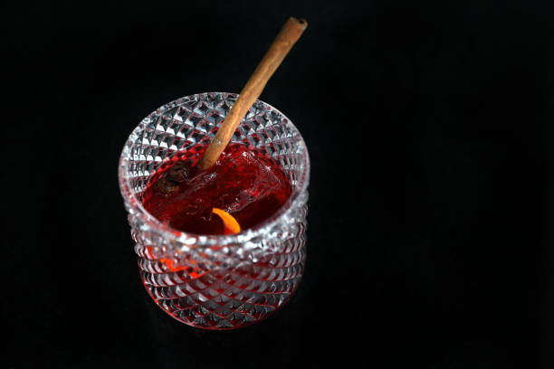istock Pink Cocktail glass with ice at a bar counter 1288065383