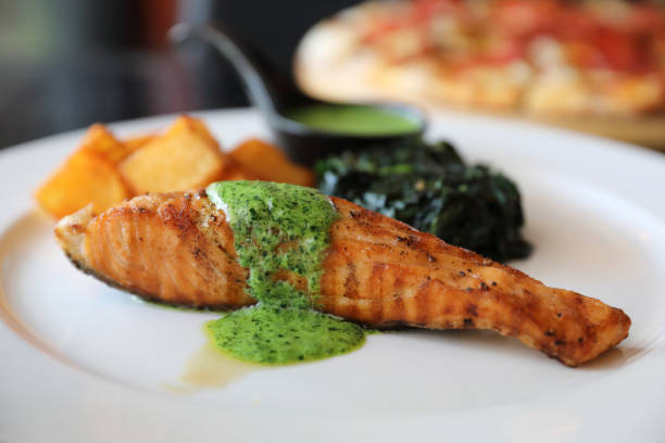 istock Salmon steak with pesto sauce 1288065519
