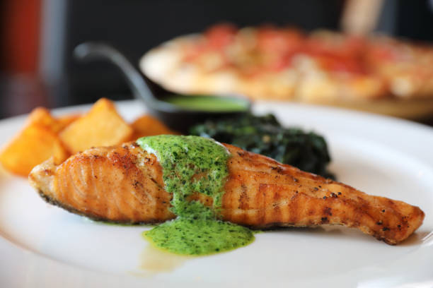 istock Salmon steak with pesto sauce 1288066092
