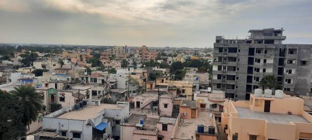 istock Cloudy city overcrowded with houses 1288066268