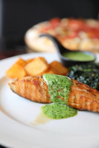 istock Salmon steak with pesto sauce 1288066451