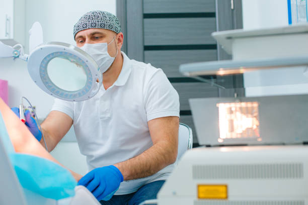istock Doctor looking at the veins through the magnifying glass 1288069083