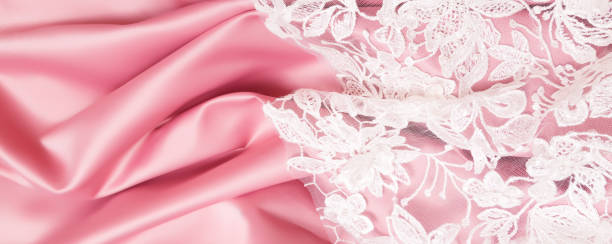 istock abstract background. Pink luxury satin fabric with guipure texture 1288069401