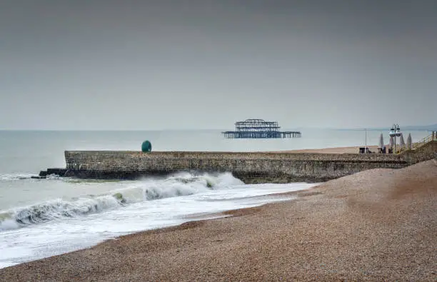 Photo of Brighton beach and seashore,looking westwards along the seashore during the late winter off season,Brighton,East Sussex,England,United Kingdom.