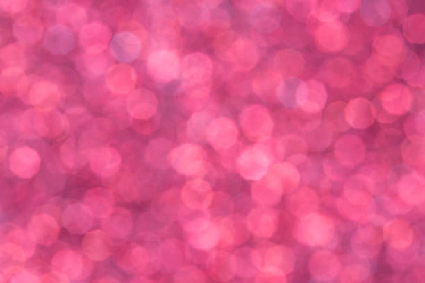 istock Abstract glowing bright purple or pink background, texture, glitter vintage glare, bokeh background 1288072212