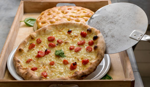 istock Italian pizza with cherry tomatoes and mozzarella cheese 1288073401