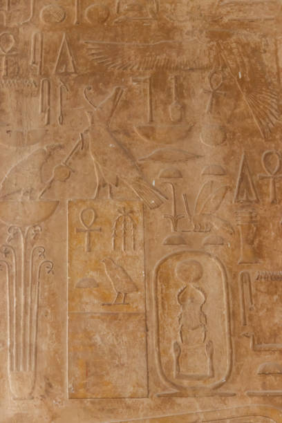 istock Ancient egyptian hieroglyphs carved on the stone wall 1288081957