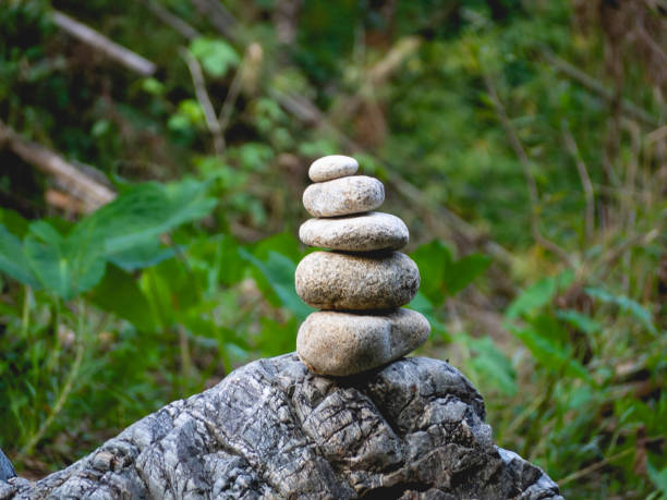 istock Stacked stones, leaves and nature 1288083329