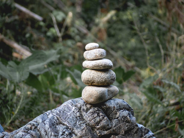 istock Stacked stones, leaves and nature 1288083337