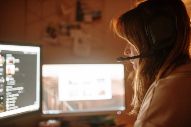 istock Young woman playing video games 1288083566
