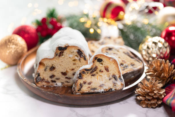istock Christmas stollen on wooden background. 1288083779