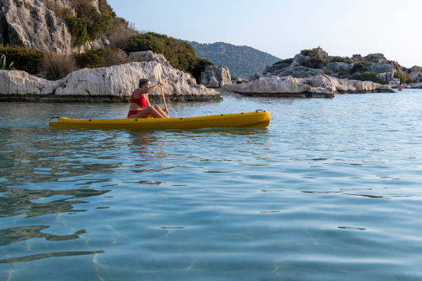 istock Joyful woman in the canoe. 1288084170