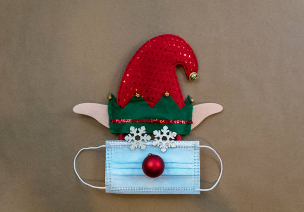 istock Festive elf hat with face mask and ornaments 1288088424