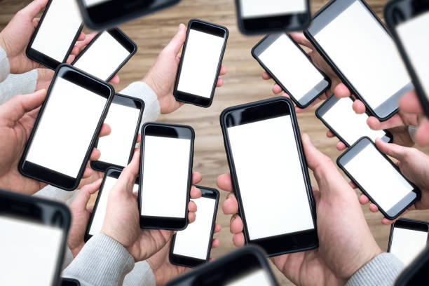 istock Many smartphones in many hands 1288088562