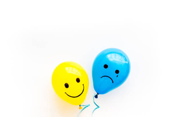 istock Emotions concept - happiness and sadness on the colored ballons. Top view 1288089362