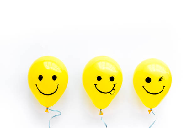 istock Happiness emotion face on balloon - joy mood background. Top view, copy space 1288089489