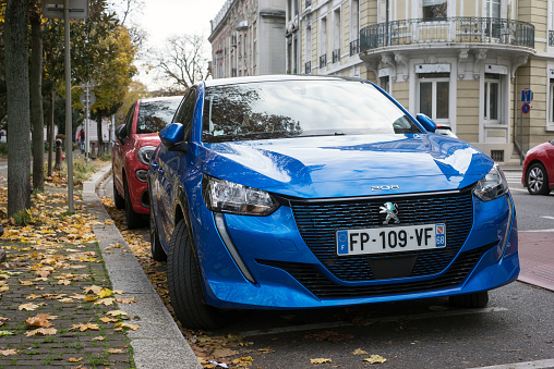 Mulhouse - France - 27 November 2020 - Front view of blue Peugeot 208 electric parked in the street