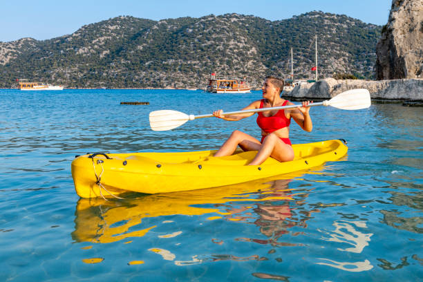 istock Joyful woman in the canoe. 1288091128