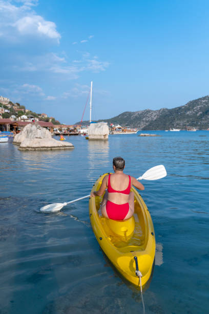 istock Joyful woman in the canoe. 1288091262