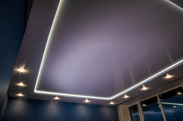 istock Beautiful stretch ceiling with led lighting, spotlights around the perimeter. 1288091640