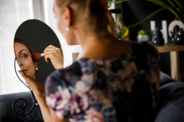 istock Woman getting ready and putting on make up 1288092837