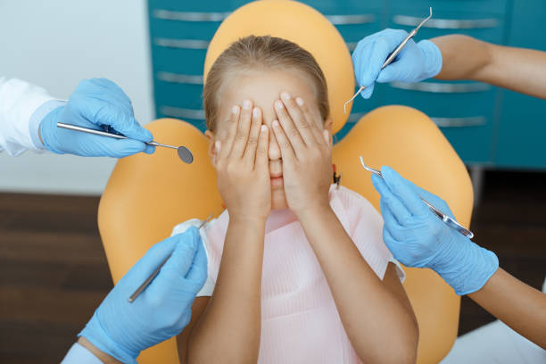 istock Children teeth treatment, profession help and visit to dentist 1288094689