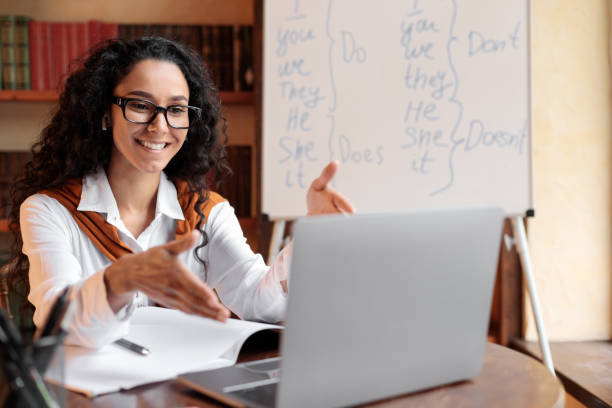 istock English teacher having video conference chat with students 1288096115