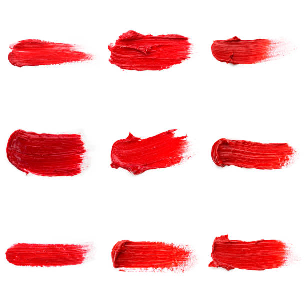istock Red colored brush stroke paiting over isolated background, canvas watercolor texture, red lipstick smudge 1288096906