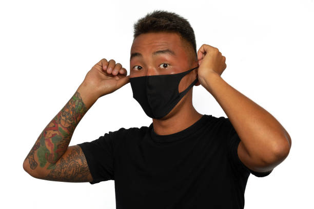 istock Young man with a protective medical mask 1288097475