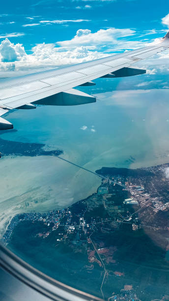 istock Sky view plane window Clouds and bright skies during the day form above 1288097573