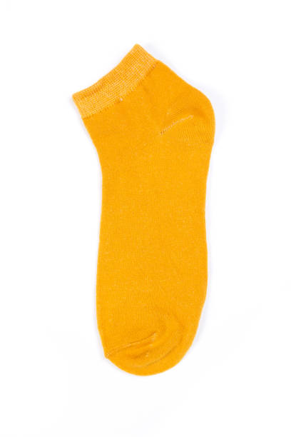 istock one yellow short sock on a white background, top view 1288097674
